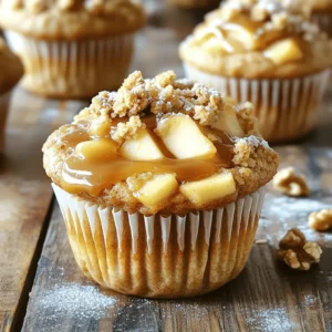 - 2 medium apples, peeled and diced (Granny Smith or Honeycrisp work well) - 1 tablespoon lemon juice - 1 cup all-purpose flour - 1 cup rolled oats - 1/2 cup brown sugar, packed - 1/4 cup granulated sugar - 1/2 teaspoon baking powder - 1/2 teaspoon baking soda - 1/2 teaspoon cinnamon - 1/4 teaspoon nutmeg - 1/2 cup unsalted butter, melted - 1/2 cup milk - 1 large egg - 1 teaspoon vanilla extract - 1/2 cup caramel sauce (store-bought or homemade) - Optional: 1/4 cup chopped walnuts or pecans - You can use other apple types like Fuji or Braeburn. These add nice sweetness. - For a gluten-free option, use almond flour or a gluten-free flour blend. - To go dairy-free, swap butter with coconut oil and milk with almond milk. - For baking, Granny Smith apples add tartness. Honeycrisp apples are sweet and crisp. - Fresh spices, like cinnamon and nutmeg, boost flavor. Use whole spices when you can. Grating them fresh gives the best taste. 1. Preheat your oven to 350°F (175°C). This helps muffins bake evenly. 2. Line a muffin tin with paper liners or grease them with cooking spray. This prevents sticking. 3. In a medium bowl, toss the diced apples with 1 tablespoon of lemon juice. This keeps the apples fresh and adds zing. 1. In a large mixing bowl, combine: - 1 cup all-purpose flour - 1 cup rolled oats - 1/2 cup packed brown sugar - 1/4 cup granulated sugar - 1/2 teaspoon baking powder - 1/2 teaspoon baking soda - 1/2 teaspoon cinnamon - 1/4 teaspoon nutmeg Mix these dry ingredients well. This step mixes flavors and helps muffins rise. 2. In another bowl, whisk together: - 1/2 cup melted unsalted butter - 1/2 cup milk - 1 large egg - 1 teaspoon vanilla extract Mix until smooth. This keeps the batter moist. 3. Pour the wet ingredients into the dry ingredients. Stir gently until just combined. Be careful not to over-mix. This keeps muffins fluffy. 4. Fold in the diced apples and optional chopped nuts. This adds texture and flavor to each bite. 1. Divide the muffin batter evenly among the muffin cups. Fill each about 2/3 full. This allows space for the muffins to rise. 2. Drizzle about 1 tablespoon of caramel sauce on top of each muffin. Use a toothpick or knife to swirl it gently. This creates a sweet surprise inside. 3. For the crumble topping, mix: - 1/4 cup rolled oats - 2 tablespoons flour - 2 tablespoons brown sugar - Any remaining melted butter Mix until crumbly, then sprinkle it over each muffin. This adds a crunchy finish. 4. Bake in the preheated oven for 18-22 minutes. Check with a toothpick; it should come out clean or with a few moist crumbs. 5. Let the muffins cool in the pan for about 5 minutes. Then, transfer them to a wire rack to cool completely. Enjoy the warm, sweet aroma! - Checking doneness: Use a toothpick. Insert it into the center. If it comes out clean, your muffins are done. If it has batter, bake a few more minutes. - Adjusting baking time for different ovens: Not all ovens heat the same. Check muffins a few minutes early. Note how your oven behaves for future baking. - Pairing with beverages: These muffins go great with coffee or warm apple cider. The sweetness of the muffins complements the drinks well. - Enhancing flavors with additional toppings: Drizzle more caramel sauce on top right before serving. A sprinkle of powdered sugar also adds a nice touch. - Adding spices or extracts: Consider adding a dash of vanilla or almond extract for extra flavor. You can also mix in a pinch of ginger for a warm kick. - Using seasonal flavors or fruits: In fall, try adding pumpkin puree. In spring, fresh berries can brighten the muffins and add a new twist. {{image_2}} You can give your caramel apple crumble muffins a twist. Try making choco-chip caramel apple muffins. Just add 1/2 cup of chocolate chips to the batter. The chocolate melts and mixes well with the apples. It adds a rich, sweet flavor that pairs perfectly with caramel. Another fun option is pumpkin spice caramel apple muffins. Replace half of the cinnamon with pumpkin spice. This will give your muffins a cozy fall flavor. You can also add 1/2 cup of pumpkin puree to the batter for extra moisture. Nuts can add a nice crunch to your muffins. Chopped walnuts or pecans work great in this recipe. Just mix in 1/4 cup of your favorite nuts when you fold in the apples. This will give your muffins an extra layer of texture. If you prefer nut-free options, skip the nuts altogether. You can also use seeds like sunflower seeds or pumpkin seeds. They will add crunch without the nut allergy risk. Crumble toppings can be fun to play with. Try using a mix of oats, flour, and sugar for a crunchy topping. This will add a sweet crunch that everyone will love. You can also use streusel instead of a crumble. For a simple streusel, mix together 1/4 cup of flour, 1/4 cup of brown sugar, and 2 tablespoons of butter. This will create a buttery, sweet topping that melts in your mouth. Just sprinkle it on top before baking. To keep your muffins fresh, use an airtight container. I recommend a plastic or glass container with a tight lid. This helps prevent them from drying out. Store the muffins at room temperature for up to three days. If you live in a humid place, the fridge may be a better option. Just note that refrigerating can make them a bit dry. If you want to save some muffins for later, freezing is a great choice. First, let the muffins cool completely. Then, wrap each muffin in plastic wrap. Place them in a freezer-safe bag or container. They can last up to three months in the freezer. When you are ready to eat, take one out and let it thaw at room temperature. For quick reheating, pop it in the microwave for about 15-20 seconds. These caramel apple crumble muffins taste best when fresh. They will stay yummy for about three days at room temperature. If stored in the fridge, they last about a week. In the freezer, they maintain flavor and texture for three months. Enjoy them while they are fresh for the best taste! Yes, you can prepare these muffins ahead of time. To do this, mix your dry ingredients and wet ingredients separately. Store the dry mix in an airtight container. Keep the wet ingredients in the fridge. When you're ready to bake, combine them. This keeps the muffins fresh and fluffy. You can also bake and store them. Let them cool, then wrap them in plastic. Keep them in the fridge or freezer. When you want one, pop it in the microwave for a few seconds. Both homemade and store-bought caramel sauces are great! If you have time, homemade sauce is rich and creamy. It tastes fresh and allows you to control the flavor. For store-bought, choose a high-quality brand. Look for one with natural ingredients. This option saves time and still tastes good. No matter which you choose, drizzle it on top for that sweet touch. You can make simple swaps to make these muffins healthier. Use whole wheat flour instead of all-purpose flour. This adds fiber and nutrients. You can reduce sugar by using applesauce instead of some brown sugar. This keeps the muffins sweet and moist. Another tip is to use low-fat milk or a milk substitute. You can also cut back on butter by using applesauce or yogurt. These swaps keep the taste while making them healthier. This blog post covers everything you need for perfect apple muffins. We discussed the best ingredients, how to prepare and bake them, plus tips for storing and serving. Remember to choose fresh apples and spices for the best taste. Explore variations to keep it fun, and don’t hesitate to make substitutions if needed. Enjoy baking and sharing your delicious muffins with others. Your kitchen will smell amazing, and your friends will love the treats!