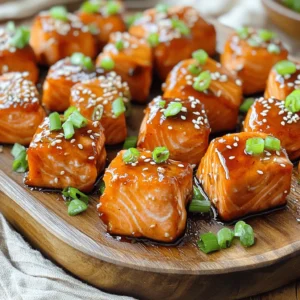 - 1 lb salmon fillet, skinless and boneless, cut into 1-inch cubes - 3 tablespoons soy sauce (or tamari for gluten-free) - 2 tablespoons honey or maple syrup - 1 tablespoon grated fresh ginger - 2 cloves garlic, minced - 1 teaspoon sesame oil - 1 tablespoon cornstarch - 2 green onions, finely sliced - Sesame seeds - Try different sweeteners for varied sweetness. - Use gluten-free substitutes if needed. This recipe has simple but rich flavors. The salmon is the star here. It cooks quickly and stays moist. The marinade adds a sweet and savory touch. Use a good soy sauce or tamari for the best taste. Honey or maple syrup works well for sweetness. Fresh ginger and garlic bring a nice kick. The sesame oil adds depth to the flavor. Cornstarch is key for that crispy bite. It helps achieve a lovely texture in the air fryer. For garnish, green onions provide a fresh crunch. Sesame seeds add a nutty taste and look pretty. You can mix and match sweeteners. If you prefer a different flavor, feel free to swap them out. This dish is also gluten-free if you choose tamari. With these ingredients, you can create a delightful meal in no time! Start by whisking together the marinade. In a bowl, mix the following: - 3 tablespoons soy sauce (or tamari for gluten-free) - 2 tablespoons honey (or maple syrup) - 1 tablespoon grated fresh ginger - 2 cloves minced garlic - 1 teaspoon sesame oil Whisk these ingredients well until they blend into a smooth mix. The honey adds sweetness, while ginger and garlic provide depth. Next, add your salmon cubes to the marinade. Use 1 lb of skinless, boneless salmon, cut into 1-inch pieces. Toss the cubes gently to coat them. Let the salmon marinate for at least 15 minutes. For better flavor, you can marinate it for up to 1 hour in the fridge. The longer it sits, the more the flavors soak in. Now it’s time to cook! Preheat your air fryer to 375°F (190°C) for about 5 minutes. While it heats, sprinkle 1 tablespoon of cornstarch over the marinated salmon. Toss gently to coat. This helps create a crispy skin. Place the salmon bites in a single layer in the air fryer basket. Avoid overcrowding the basket to ensure even cooking. Air fry the salmon for 8-10 minutes. Shake the basket halfway through to promote even cooking. Check that the internal temperature reaches 145°F (63°C). When done, carefully take them out and serve. Enjoy these tasty bites! Cornstarch is your best friend for crispy salmon bites. It forms a nice coating that helps them fry up crunchy. Make sure to sprinkle it evenly over the salmon. Toss gently to coat each piece. Also, avoid overcrowding the air fryer basket. If you fit too many pieces in, they steam instead of fry. Cook in batches if needed. For the best flavor, marinate the salmon for at least 15 minutes. This helps the marinade soak in well. If you have time, let it sit for an hour in the fridge. You can also add other spices to your marinade. A pinch of red pepper flakes adds a nice heat. Fresh herbs like cilantro can brighten the flavor too. Choose an air fryer with good reviews for even cooking. I recommend models that let you check the food without opening the drawer. To check for doneness, the salmon should reach 145°F (63°C). Use a meat thermometer to be sure. This way, you avoid undercooking or overcooking your salmon bites. {{image_2}} You can change the taste of your teriyaki salmon bites in fun ways. One option is to add sesame seeds and furikake. This adds a nutty crunch and a burst of umami. Furikake is a Japanese seasoning that can enhance the flavor. You can also make a spicy version by adding chili flakes or sriracha. This will give your bites a nice kick. Adjust the spice level to fit your taste. While air frying gives nice crispiness, you can try baking or grilling salmon bites, too. Baking requires a preheated oven at 400°F (200°C) for about 12-15 minutes. Just keep an eye on them. Grilling can add great flavor as well. Grill them over medium heat for about 3-4 minutes per side. Both methods can still achieve a tasty meal. What you pair with your salmon bites can really elevate the meal. A simple side of rice or quinoa works well. You can also serve them with a fresh salad for a lighter option. For extra flavor, consider adding dips or sauces like a tangy soy sauce or a creamy avocado sauce. These will complement the teriyaki flavor and make each bite even better. To store leftovers, let the salmon bites cool down first. Place them in an airtight container. This keeps them fresh and prevents strong smells. You can store them in the fridge for up to three days. Make sure to label your container with the date. If you want to freeze salmon bites, first, let them cool completely. Then, place them in a freezer bag or a tight container. Remove as much air as possible to avoid freezer burn. You can freeze them for up to three months. To reheat, thaw them overnight in the fridge. Then, air fry them at 375°F (190°C) for about 5-7 minutes. This keeps them crispy. When stored properly, the shelf life of teriyaki salmon bites is about three days in the fridge. If frozen, they can last up to three months. Always check for any off smells or changes in texture before eating leftovers. Marinate the salmon for at least 15 minutes. This time allows the flavors to soak in. For even better taste, try marinating for up to 1 hour in the fridge. The longer you marinate, the more robust the flavor. Yes, you can use frozen salmon. However, thaw it completely before marinating. This ensures the marinade coats the salmon well. Thaw it in the fridge overnight or use a quick thaw method under cool running water. The ideal internal temperature for cooked salmon is 145°F (63°C). Use a meat thermometer to check. At this temperature, the salmon should be flaky and moist, not dry. Yes, this recipe can be gluten-free. Use tamari instead of soy sauce. Tamari is a gluten-free soy sauce. Always check labels to ensure other ingredients are also gluten-free. To add heat, mix in chili flakes or sriracha into the marinade. Start with a small amount and adjust to taste. You can also add sliced jalapeños for an extra kick. This recipe for air-fried salmon bites offers a simple, tasty dish. You learned about the main ingredients and optional variations to suit your taste. I shared steps for marinating and cooking, plus tips for the best results. These salmon bites are adaptable, whether you want them sweet or spicy. With easy storage methods, you can enjoy leftovers too. Experiment with flavors and serving ideas for a fun meal. Now, it's your turn to try cooking these bites and impress everyone around you!