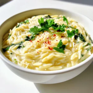 - 1 cup orzo pasta - 2 tablespoons olive oil - 4 cloves garlic, minced - 3 cups fresh spinach, chopped - 4 cups vegetable broth - 1 cup heavy cream - 1 cup grated Parmesan cheese - Salt and pepper to taste - 1/2 teaspoon red pepper flakes (optional) - Fresh parsley, chopped for garnish When choosing your ingredients, freshness matters. Fresh spinach will give your dish a bright taste. Use high-quality olive oil for better flavor. Grated Parmesan cheese melts well and adds a rich taste. Opt for low-sodium vegetable broth if you want to control salt levels. You can swap out the orzo for gluten-free pasta if needed. For a lighter version, use half and half instead of heavy cream. If you want a dairy-free option, try nutritional yeast for a cheesy flavor. Fresh spinach can be replaced with kale or arugula for a different twist. This dish cooks in one pot, making it easy and quick. You heat olive oil, sauté garlic, and add orzo. Next, you pour in broth, let it simmer, and finish with cream and cheese. It’s creamy, cheesy, and full of flavor. 1. Heat the olive oil: Start by pouring 2 tablespoons of olive oil into a large pot over medium heat. 2. Sauté garlic: Add 4 minced garlic cloves. Cook for about 1-2 minutes. You want it fragrant but not browned. 3. Add orzo: Stir in 1 cup of orzo pasta. Cook for an extra minute to let it toast slightly. 4. Add broth: Pour in 4 cups of vegetable broth. Bring it to a boil. 5. Simmer the orzo: Reduce the heat to medium-low. Let it simmer for 7-10 minutes, stirring now and then. The orzo should be tender and most of the liquid absorbed. 6. Add spinach: Mix in 3 cups of chopped spinach. Cook for 2-3 minutes until the spinach wilts. 7. Finish with cream and cheese: Stir in 1 cup of heavy cream and 1 cup of grated Parmesan cheese. Mix until creamy. 8. Season: Add salt, pepper, and 1/2 teaspoon of red pepper flakes (if you like heat). Adjust to your taste. 9. Let it sit: Reduce the heat to low. Let it simmer for another 2-3 minutes. This helps all the flavors blend. - When you sauté garlic, watch it closely. It can burn quickly, which will make it bitter. - Toasting the orzo adds a nice nutty flavor. Don’t skip this step! - Stirring the orzo while it simmers helps prevent sticking. Keep an eye on it! - For extra creaminess, add more cream or cheese at the end. Taste as you go. - Letting the dish sit before serving helps thicken it. It’s worth the wait! To boost flavor, always use fresh garlic. Fresh garlic adds a strong and rich taste. You can also add herbs like thyme or basil. This gives the dish a nice aroma. If you enjoy a bit of heat, red pepper flakes work wonders. They add a gentle kick. Fresh lemon juice at the end brightens up the entire dish. It cuts through the creaminess and adds zest. When cooking orzo, keep stirring. This prevents it from sticking to the pot. Toasting the orzo for a minute adds a nice nutty flavor. Use low-sodium vegetable broth. This gives you control over salt levels. For an extra creamy texture, let the dish sit before serving. This helps the flavors meld together. If you want a thicker sauce, simmer it a little longer. A common mistake is overcooking the orzo. It should be just tender, not mushy. Always taste before adding more salt or pepper. You can always add more, but you can’t take it away. Don’t skip the resting time after cooking. It allows the sauce to thicken and the flavors to deepen. Lastly, don’t be shy with the cheese. A generous amount of Parmesan makes a huge difference! {{image_2}} You can switch up the ingredients in this dish. Instead of orzo, try using quinoa or rice. These grains will still soak up the flavors well. For a twist, substitute vegetable broth with chicken broth. This change adds a deeper flavor to the dish. You can also replace heavy cream with Greek yogurt. This swap keeps it creamy while cutting some fat. To make this recipe vegan, replace heavy cream with coconut cream or cashew cream. These options maintain creaminess without dairy. Use nutritional yeast instead of Parmesan cheese for a cheesy taste. For the broth, always choose vegetable broth to keep it vegan. This ensures all your ingredients align with your dietary choice. Want to add more flavor? Toss in some sun-dried tomatoes or olives. These will bring a savory kick. For spice lovers, increase the red pepper flakes. Fresh herbs like basil or thyme can also brighten the dish. Experiment with lemon zest for a fresh twist. Each of these ideas can take your One Pot Garlic Parmesan Orzo to new heights! To store your leftover orzo, first let it cool. Place it in an airtight container. This keeps it fresh for later meals. You can store it in the fridge for about three to four days. If you want to enjoy it later, freezing is a great option. When you’re ready to enjoy your orzo again, heat it on the stove or in the microwave. For the stovetop, add a splash of vegetable broth or cream to help it rehydrate. Stir often until warm. If using the microwave, heat in short bursts. Stir between each burst until it’s hot all the way through. To freeze the orzo, place it in a freezer-safe container. Make sure to leave some space for expansion. It can stay in the freezer for up to three months. When you want to eat it, move it to the fridge overnight. Reheat it as mentioned before. This way, you keep the creamy texture and flavors intact. To make this recipe gluten-free, you can swap the orzo pasta for gluten-free orzo. Many brands offer pasta made from rice or corn that works well. Just check the cooking time, as gluten-free pasta may need slight adjustments. This way, you get the same creamy texture without the gluten. Yes, you can use frozen spinach. It’s a great time-saver! Just thaw and drain it before adding it to the pot. Frozen spinach is already cooked, so add it in the last few minutes of cooking. This gives it enough time to warm up and blend with the orzo. One Pot Garlic Parmesan Orzo pairs well with many dishes. A simple side salad adds freshness. Grilled chicken or shrimp can add protein and flavor. You can also serve it with crusty bread to soak up the creamy sauce. Enjoy it with a glass of white wine for an extra treat! This article covered the main ingredients and how to prepare your dish. I shared step-by-step instructions for perfect results. We discussed tips for enhancing flavors and avoiding common mistakes. I also suggested substitutions for various diets and how to store leftovers. Cooking is all about experimenting and finding what works for you. Use these guidelines to create a meal you love. Enjoy your cooking journey!