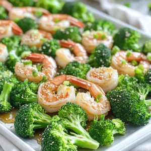 - 1 lb large shrimp, peeled and deveined - 2 cups broccoli florets - 1/4 cup honey - 3 tablespoons soy sauce For this dish, large shrimp are the star. They soak up the sweet and salty flavors well. Fresh broccoli florets add crunch and color. Honey and soy sauce create a tasty glaze that brings everything together. - 2 tablespoons olive oil - 4 cloves garlic, minced - 1 teaspoon ginger, grated - 1 teaspoon sesame oil - 1 tablespoon sesame seeds (for garnish) - Sliced green onions (for garnish) Olive oil adds richness to the dish. Garlic and ginger bring a lovely aroma. Sesame oil gives a nutty flavor. For garnish, sesame seeds and green onions add a pop of color and crunch. - Salt and pepper to taste For a simple yet effective flavor boost, salt and pepper are key. You can also play with other flavors. Try adding chili flakes for heat or lemon juice for brightness. These small changes can make a big impact on taste. First, preheat your oven to 400°F (200°C). This heat will cook the shrimp and broccoli perfectly. Next, line a large baking sheet with parchment paper. This helps with easy cleanup later. Now, let’s make the marinade. In a bowl, whisk together these ingredients: - 1/4 cup honey - 3 tablespoons soy sauce - 2 tablespoons olive oil - 4 cloves garlic, minced - 1 teaspoon ginger, grated - 1 teaspoon sesame oil - Salt and pepper to taste This mix brings a sweet and savory flavor to the dish. Add 1 pound of large, peeled, and deveined shrimp to the marinade. Make sure each piece is well-coated. This step is key for flavor. Let the shrimp marinate for about 15 minutes. It’s just enough time for the flavors to soak in. While the shrimp marinates, prepare 2 cups of broccoli florets. Place them on the prepared baking sheet. Drizzle with olive oil, salt, and pepper, then toss to coat. After marinating, arrange the shrimp on the same baking sheet with the broccoli. Spread them out in a single layer. This helps them cook evenly. Now, bake in the preheated oven for 10-12 minutes. Watch for the shrimp to turn pink and opaque. The broccoli should be tender yet crisp. Once done, remove from the oven. Garnish with sesame seeds and sliced green onions for added flavor and style. Enjoy your meal right away, either on the baking sheet or a platter! To ensure even cooking for shrimp and broccoli, spread them out on the baking sheet. If they touch, they may steam instead of roast. This can lead to uneven cooking. For marinating times, if you're busy, even 5 minutes makes a difference. If you have more time, let the shrimp marinate for up to 30 minutes. This way, you get more flavor. For creative plating, try serving the shrimp and broccoli on a large platter. You can arrange them in a circle with a sprinkle of sesame seeds in the center. This looks nice and makes it easy for everyone to serve themselves. You can pair this dish with rice or quinoa. These sides soak up the honey garlic sauce well. You can also serve it with a light salad to balance the meal. If you want to change things up, consider using bell peppers or snap peas instead of broccoli. They add color and crunch. For garnish, try adding chopped cilantro or a squeeze of lime. This adds freshness and makes the dish pop visually. Don't shy away from experimenting; it’s all about making it your own! {{image_2}} You can switch up the veggies in this dish. Try using bell peppers or snap peas for a twist. They add a nice crunch and bright color. If you prefer another protein, tofu or chicken works well too. Just marinate them like the shrimp. Each option gives a fresh take on the classic recipe. Want to spice things up? Add sriracha or red pepper flakes to the marinade. This gives your dish a nice kick. If you like it sweeter, maple syrup is a great substitute for honey. It brings a different flavor that pairs well with garlic. Feel free to get creative with flavors! If you need a gluten-free option, use tamari instead of soy sauce. It gives the same great taste without the gluten. For those who want a vegan version, swap the shrimp for chickpeas or more veggies. This way, everyone can enjoy this tasty dish! To keep your honey garlic shrimp and broccoli fresh, use airtight containers. Glass or plastic containers work well. Make sure to cool the dish before sealing it. Store the leftovers in the fridge for up to three days. If you want to save them longer, freeze the shrimp and broccoli in freezer-safe bags. Press out as much air as you can before sealing. This helps prevent freezer burn. When reheating, I suggest using an oven or a stovetop. For the oven, preheat it to 350°F (175°C). Spread the shrimp and broccoli on a baking sheet. Heat for about 10 minutes. This method keeps the texture intact. On the stovetop, use a skillet over medium heat. Stir the shrimp and broccoli for about five minutes. Make sure they are heated through but not overcooked. In the fridge, your leftovers will last about three days. In the freezer, they can stay good for up to three months. Check for any off smells or changes in color. If the shrimp looks dull or the broccoli is slimy, it’s best to throw it out. Always trust your senses when it comes to food safety. How do I know when shrimp is fully cooked? You can tell shrimp is cooked when it turns pink and opaque. The flesh should also feel firm to the touch. This usually takes about 10 to 12 minutes when baking. If you are unsure, cut one shrimp in half. It should be white and not translucent. Can this recipe be made ahead of time? Yes! You can prepare the marinade a day in advance. Just store it in the fridge. You can also marinate the shrimp for up to one hour before baking. This helps the flavors blend well. However, I recommend cooking it fresh for the best taste and texture. Can I use frozen shrimp or broccoli? Absolutely! You can use frozen shrimp or broccoli. Just make sure to thaw them well before cooking. Drain any excess moisture to avoid sogginess. This way, you still get that nice crispness in your dish. How can I make this dish spicy? To add some heat, mix sriracha into the marinade. You can start with one teaspoon and adjust to your taste. Another option is to sprinkle red pepper flakes on the shrimp and broccoli before baking. This will give it a nice kick! Caloric content per serving Each serving of this dish has about 250 calories. This is a great option for a quick meal that is satisfying and healthy. Key nutrient breakdown of the dish - Protein: Shrimp is high in protein, giving you about 25 grams per serving. - Fiber: Broccoli adds fiber, which is great for digestion. - Vitamins: This dish is rich in vitamins C and K, thanks to the broccoli. - Healthy fats: Olive oil provides healthy fats for your diet. This dish is not only tasty but also packed with nutrients! This blog post guides you through a tasty shrimp and broccoli dish. You learned the key ingredients, the step-by-step cooking process, and tips for serving. We explored variations for different diets and how to store leftovers correctly. Cooking should be fun and easy. With this recipe, you can impress your friends and family. Don't hesitate to swap ingredients to make it your own. Enjoy your cooking adventure, and savor every bite!