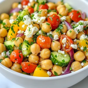 - 1 can (15 oz) chickpeas, drained and rinsed - 1 cup cherry tomatoes, halved - 1 cucumber, diced - 1 bell pepper (any color), diced - 1/2 red onion, finely chopped - 1/4 cup Kalamata olives, pitted and sliced - 1/4 cup feta cheese, crumbled (optional) - 1/4 cup fresh parsley, chopped Chickpeas are the star of this dish. They are packed with protein and fiber. Fresh vegetables add crunch and color. Cherry tomatoes bring sweetness, while cucumbers cool the mix. Bell peppers add a sweet bite. Red onion gives a sharp taste. Kalamata olives add a salty kick. Feta cheese, if used, adds creaminess. Fresh parsley brightens the salad. - 3 tablespoons olive oil - 2 tablespoons lemon juice - 1 teaspoon dried oregano - Salt and pepper to taste The dressing is simple yet tasty. Olive oil provides a rich base. Lemon juice adds zing and freshness. Dried oregano gives a classic Mediterranean flavor. Use salt and pepper to enhance the taste. - Serve the salad chilled or at room temperature. - Pair it with pita bread or grilled chicken for a full meal. - Enjoy it as a light lunch or a side dish at dinner. This salad looks great in a bowl. The colors pop, making it inviting. You can add extra olives or cheese for a twist. {{ingredient_image_1}} Combining the ingredients Start by rinsing and draining one can of chickpeas. Place the chickpeas in a large mixing bowl. Next, add one cup of halved cherry tomatoes, one diced cucumber, and one diced bell pepper. Toss in half a finely chopped red onion and a quarter cup of sliced Kalamata olives. If you like, fold in a quarter cup of crumbled feta cheese and a quarter cup of chopped fresh parsley. Mix everything gently to combine. Making the dressing In a small bowl, whisk together three tablespoons of olive oil, two tablespoons of lemon juice, and one teaspoon of dried oregano. Add salt and pepper to taste. This dressing will brighten up the salad and bring all the flavors together. Tossing the salad Pour the dressing over the salad ingredients. Use a spatula to toss everything gently. Make sure every piece is coated in that tasty dressing. This step is key to ensure every bite is full of flavor. Allowing to rest After tossing, let the salad sit for about ten minutes. This resting time helps the flavors meld together. It also allows the vegetables to soak up the dressing, making each bite even more delicious. Presentation tips When ready to serve, you can plate the salad in a large bowl. For a nice touch, sprinkle some extra feta and parsley on top. You can also serve it in individual bowls for a more personal feel. Recommended serving size This recipe serves four people. It makes a great side dish or a light main meal. Enjoy it with some crusty bread or as part of a picnic spread. Fresh ingredients make a big difference. Use ripe cherry tomatoes and crisp cucumbers. Look for bright bell peppers and fresh parsley. Rinse your chickpeas well to remove extra salt. This keeps your salad light and tasty. When mixing, use a large bowl. Gently fold in the ingredients. This helps keep the veggies whole. You want nice bites, not mush. Feel free to add or swap ingredients. You can use other beans like black beans or kidney beans. Add some avocado for creaminess. If you like heat, toss in jalapeños. They give a nice kick! Adjust your seasonings to match your taste. Add more lemon juice for tang. Or sprinkle in extra dried oregano for more flavor. You can make this salad ahead of time. It tastes even better after sitting for a while. Let the flavors meld together in the fridge. Store your salad in an airtight container. It lasts about 3 days. If you want to keep it longer, store dressings separately. This keeps your salad fresh and crunchy. Pro Tips Use Fresh Ingredients: Whenever possible, opt for fresh vegetables and herbs to enhance the flavor and nutritional value of your salad. Chill Before Serving: For an even more refreshing taste, refrigerate the salad for 30 minutes before serving. This allows the flavors to blend beautifully. Customize Your Salad: Feel free to add other ingredients like avocado, arugula, or even grilled chicken for additional flavor and protein. Keep it Vegan: If you're vegan, simply omit the feta cheese or replace it with a plant-based alternative to keep the dish dairy-free. {{image_2}} You can change the base of your Mediterranean chickpea salad. Quinoa or couscous works great. They bring a nice texture and flavor. If you want a different twist, try using other beans. Black beans or kidney beans add a unique taste. Just make sure to drain and rinse them, too. To boost the flavor, add spices or herbs. Try cumin or fresh basil for a twist. You can also mix in different cheeses. Goat cheese or mozzarella can make this salad even tastier. Just remember to crumble or slice them small for even distribution. You can adapt this salad for each season. In summer, add fresh corn or ripe peaches. These ingredients make it light and refreshing. For fall, consider roasted sweet potatoes or butternut squash. They add warmth and richness to the dish. Embrace what’s fresh and in season for the best flavors! To keep your Mediterranean chickpea salad fresh, use the right storage methods. Place the salad in an airtight container. This helps keep air out and flavors in. Glass containers work best, but BPA-free plastic ones are fine too. Make sure the container is clean and dry before adding your salad. How long can it stay in the fridge? When stored well, your salad can last up to three days. After that, it may lose its crunch and taste. Look for signs of spoilage. If the salad smells sour or the veggies look mushy, it's time to toss it. Always trust your nose and eyes! Can you freeze chickpea salad? Freezing is not the best choice for this salad. It can change the texture of the veggies and make them mushy. However, you can freeze the components. For example, freeze the chickpeas and the dressing separately. To freeze, place them in freezer-safe bags. Squeeze out air and seal tightly. When ready to use, thaw in the fridge overnight. Mix everything fresh when you're ready to enjoy! To make a vegan version, simply leave out the feta cheese. This salad still tastes great without it. You can add extra olives or avocado for creaminess. For dressings, try using tahini or a mix of olive oil and lemon juice. Both options keep the salad fresh and tasty. Yes, you can make this salad ahead of time! For best results, prepare the salad and store it in the fridge. This keeps it cool and crisp. The flavors mix well when it sits. I recommend letting it chill for at least an hour before serving. This allows the taste to deepen. Chickpeas pack a punch with protein and fiber. They help keep you full and satisfied. One cup offers about 15 grams of protein and 12 grams of fiber. They also provide vitamins and minerals, like iron and folate. Eating chickpeas can support heart health and digestion too. This blog post guided you through making a tasty Mediterranean chickpea salad. We explored the main ingredients, from chickpeas to fresh veggies. You learned how to prepare the dressing and assemble the salad. Tips helped you enhance flavors and keep it fresh for longer. Incorporating variations can add excitement to your meals. Remember, meal prep makes life easier. Enjoy creating your own versions, and don't be afraid to experiment. With these steps, you’ll serve a delicious dish that can impress anyone!